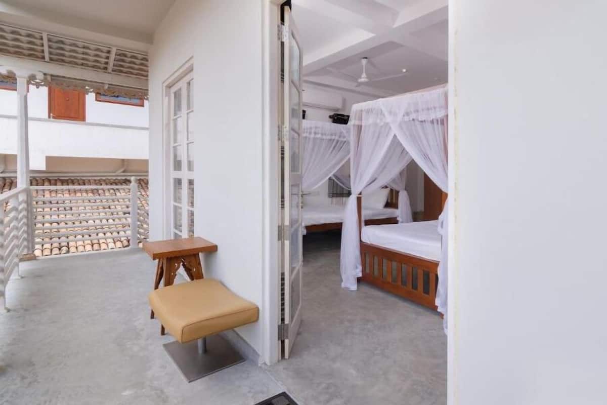 Luxury Triple Room | Minibar, in-room safe, desk, laptop workspace