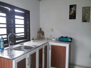 Fridge, electric kettle, cookware/dishes/utensils, spices