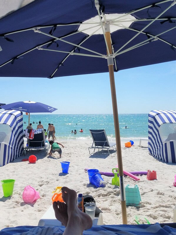 Relax on the beach with stunning ocean views and comfortable lounge chairs.