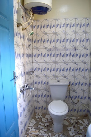 Shower, towels, soap, toilet paper