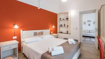 Deluxe Room | Down comforters, minibar, individually decorated, individually furnished