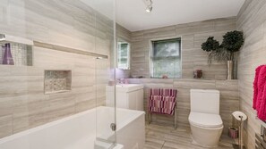 Bathtub, hair dryer, towels