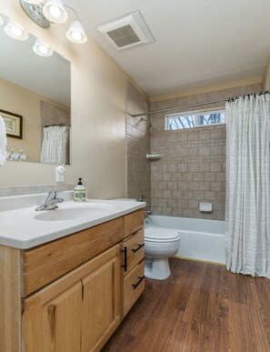 Bathtub, hair dryer, towels, soap
