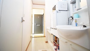 Apartment | Bathroom | Shower, free toiletries, hair dryer, slippers - Start One Home Torigoe 204 (Tokyo)