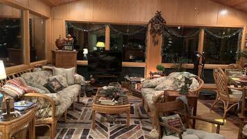 Sunroom sitting & lounging area. TV, DVD & VHS