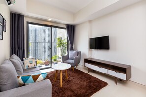 Familieleilighet | Oppholdsrom | En 40-tommers Flatskjerm-TV med kabel-kanaler samt TV