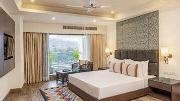 Minibar, desk, laptop workspace, iron/ironing board