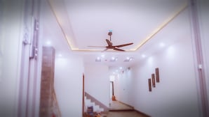 Luxury Apartment | Living area | 32-inch Smart TV with cable channels, TV - Sea View Homestay (Da Nang)