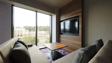 Habitación ejecutiva con 2 camas individuales | Área de sala de estar | Televisión de pantalla plana