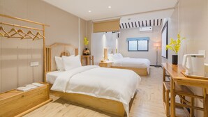 A hotel room with two beds, wooden furniture, a wardrobe, a bedside table, a lamp, and a window with a view. - Floral Hotel Yi Shu Yu She Zhouzhuang (Suzhou)