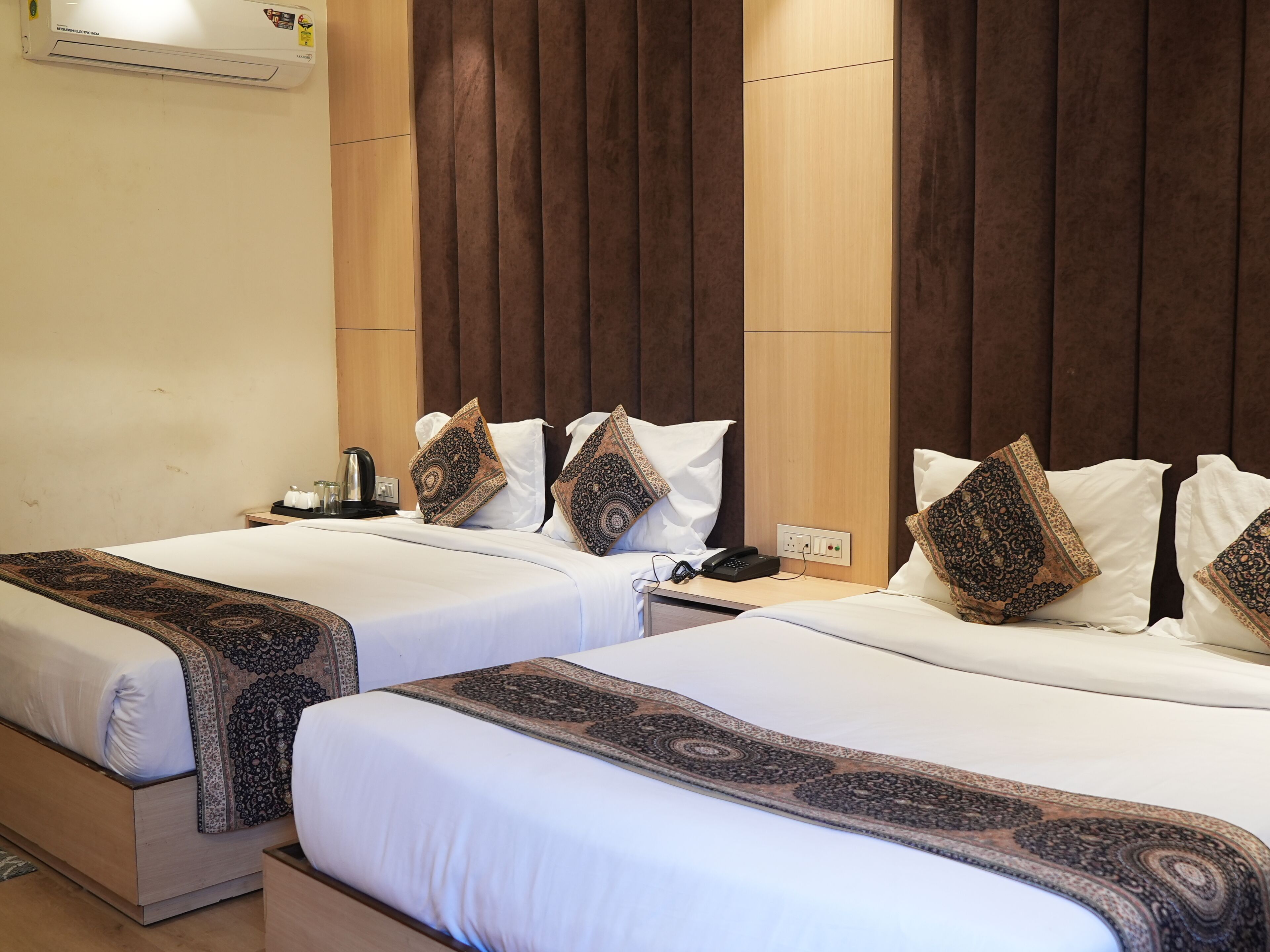 Premium bedding, memory-foam beds, desk, laptop workspace