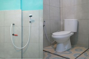 Habitación doble | Baño | Regadera y toallas 