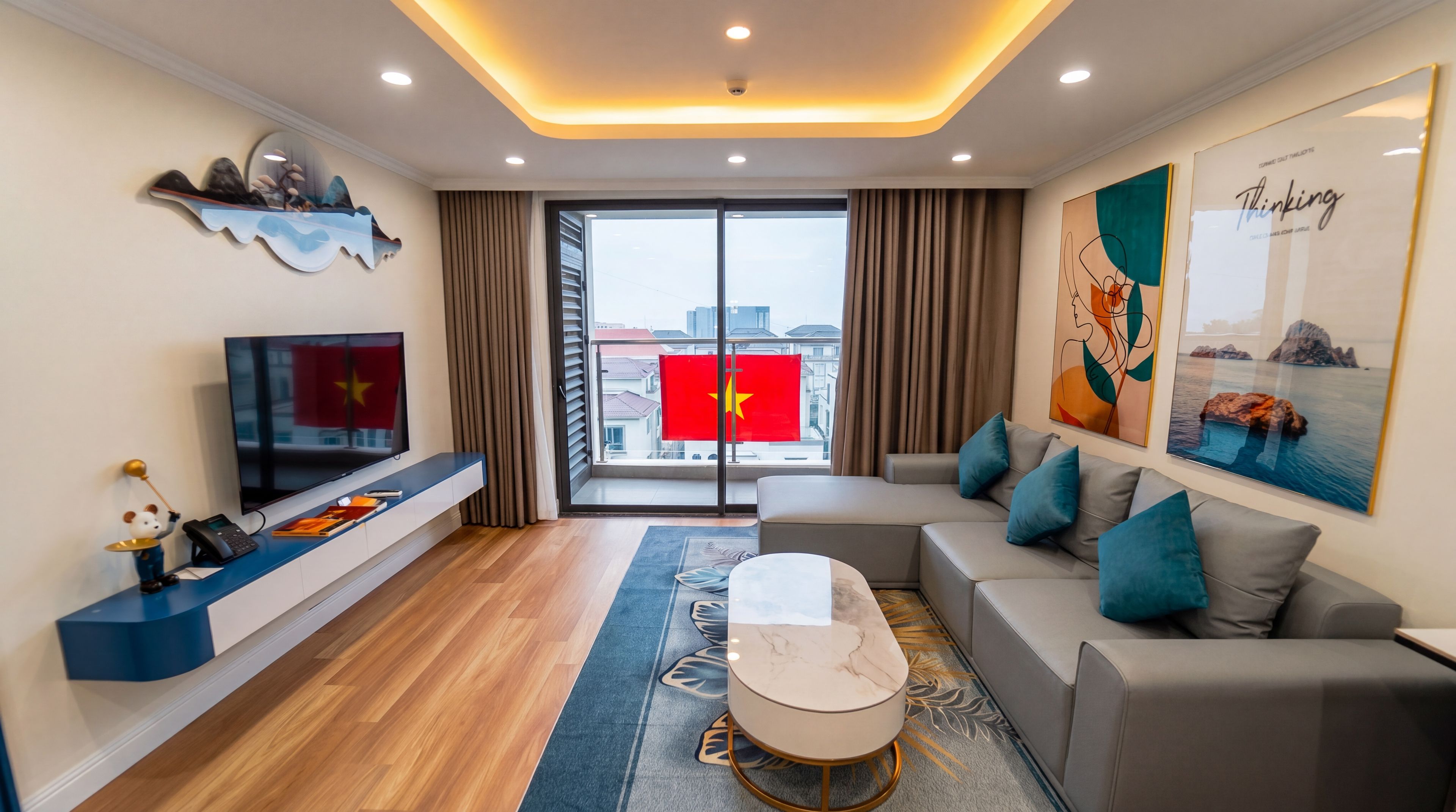 A modern living room with a sofa, coffee table, and a flat-screen TV.