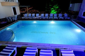Outdoor pool, pool umbrellas, sun loungers