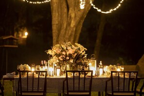 Enjoy a romantic dinner under the stars at this serene garden setting.