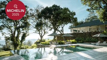 Outdoor pool, pool umbrellas, sun loungers