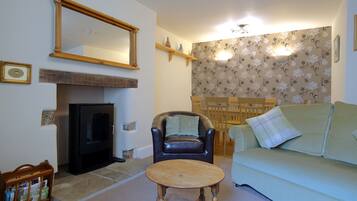 Family Cottage | Living area | 43-inch flat-screen TV with digital channels, TV, fireplace