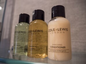 Three bottles of Cole & Lewis London products on a shelf. - Waterfront House (Dartmouth)