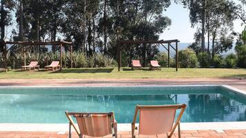 Outdoor pool, pool umbrellas, sun loungers