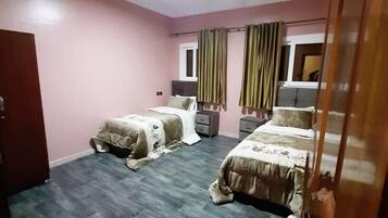 Apartment, 3 Bedrooms | 2 bedrooms, blackout curtains, rollaway beds, free WiFi