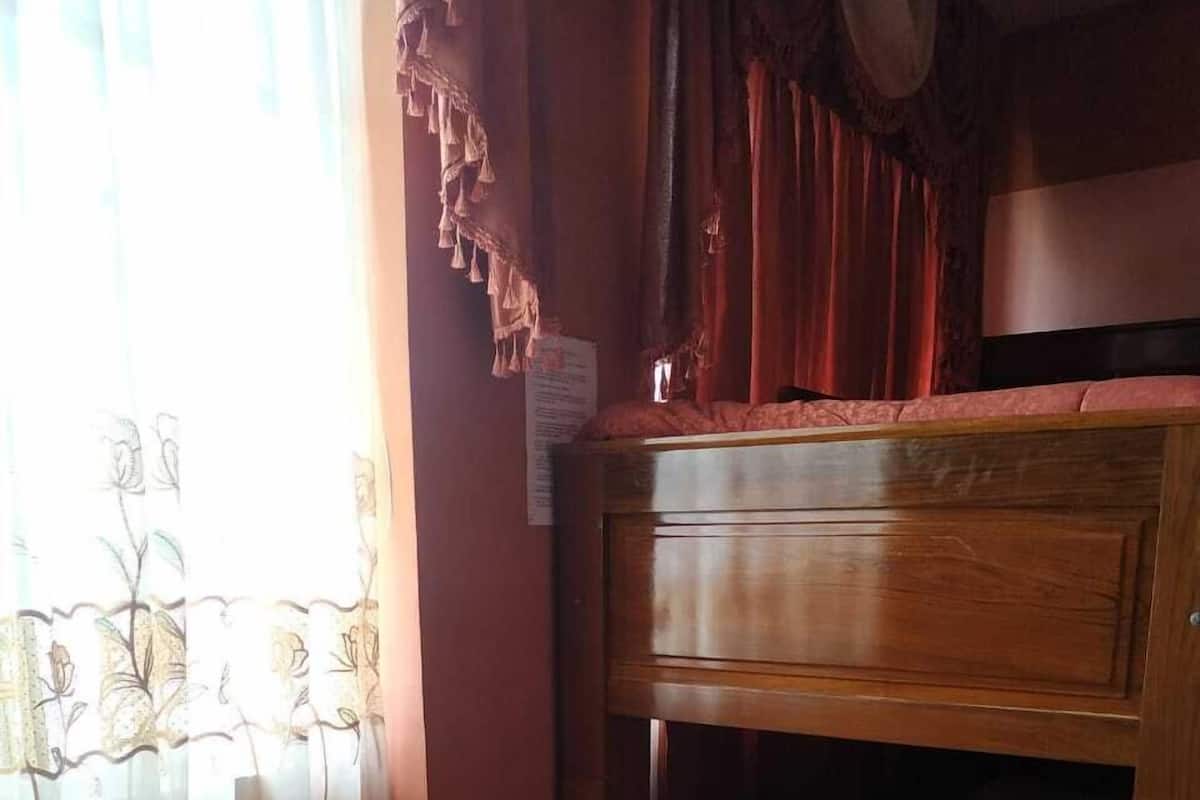 Economy Quadruple Room, Multiple Beds, Shared Bathroom | In-room safe, individually furnished, desk, laptop workspace