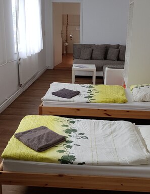 Triple Room, Private Bathroom | Desk, blackout drapes, free WiFi, bed sheets