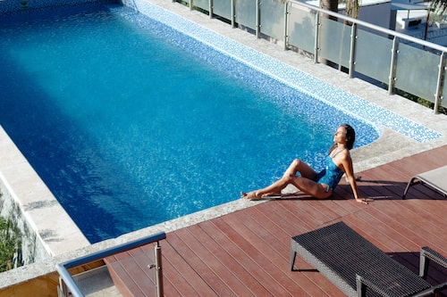 Outdoor pool, open 8:00 AM to 10:00 PM, pool umbrellas