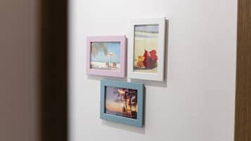 Three framed pictures on a wall.