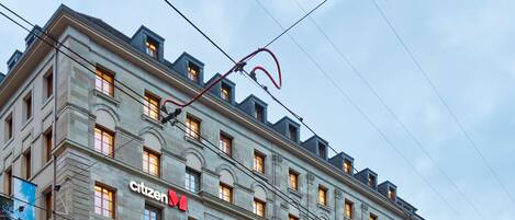 A multi-story building with a prominent "citizen" sign, indicating a commercial or public space.
