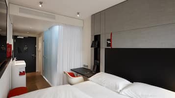 Luxe beddengoed, pillowtop-bedden, een kluis op de kamer, een bureau