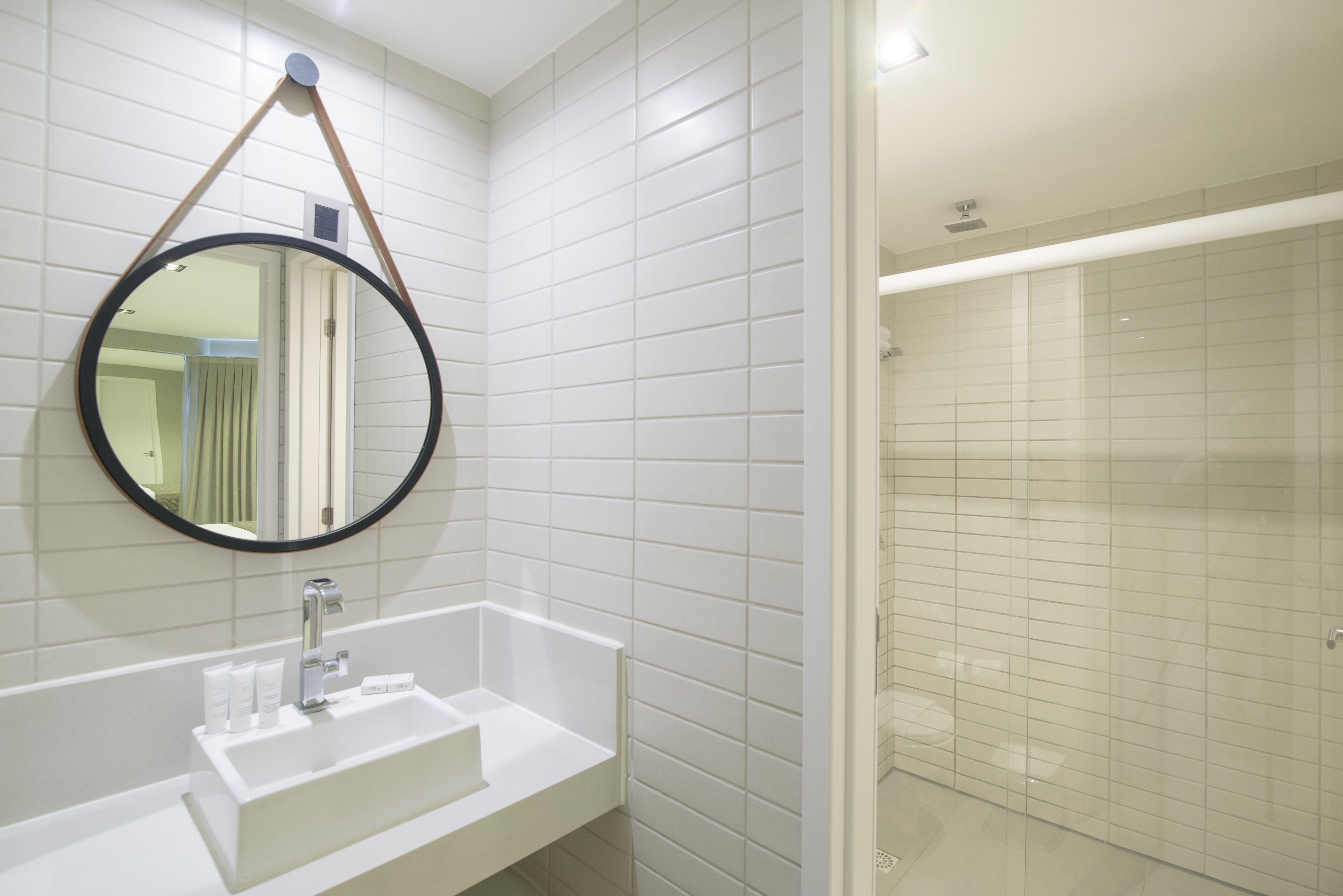 deluxe room | bathroom | shower, hair dryer, towels, soap