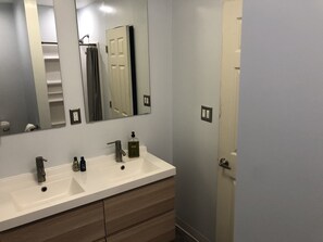 Bathtub, hair dryer, towels, soap