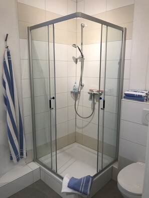 Shower, hair dryer, towels, soap