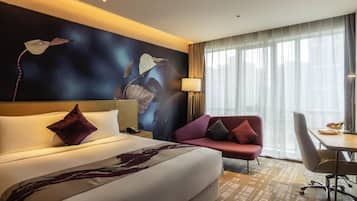 Premium bedding, down comforters, pillowtop beds, minibar