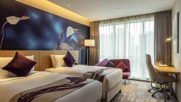 Premium bedding, down duvets, pillow-top beds, minibar