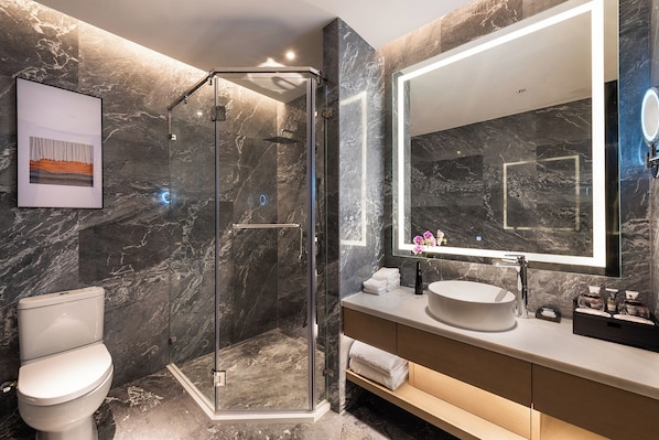 A modern bathroom with a glass-enclosed shower, a large mirror, and a white sink. - Shenzhen Longgang Kunyi Mercure Hotel (Shenzhen)