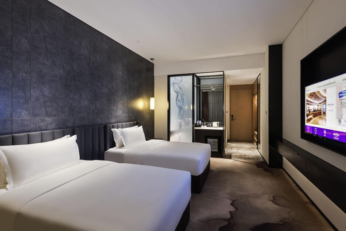 Chambre Deluxe, 2 lits jumeaux | Minibar, coffre-fort, bureau, systĂšme dâinsonorisation