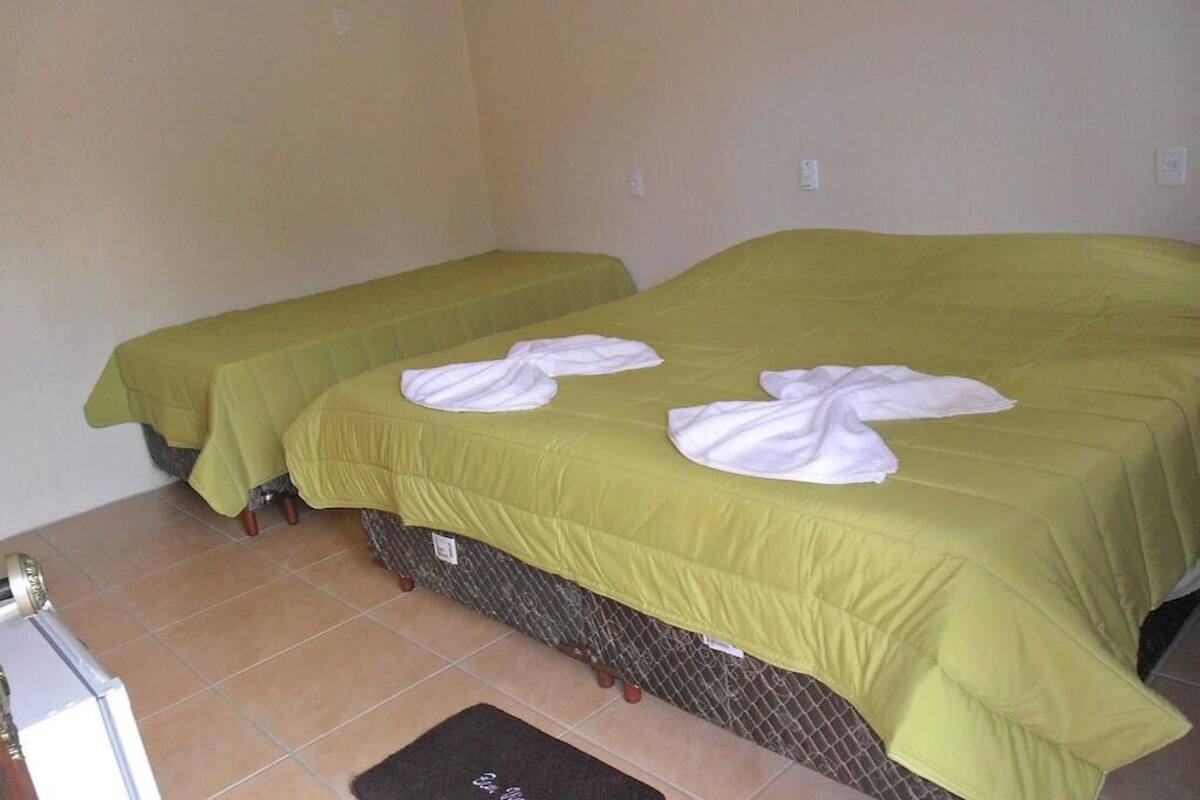 Basic Triple Room | Minibar, iron/ironing board (on request), WiFi (free), bed sheets