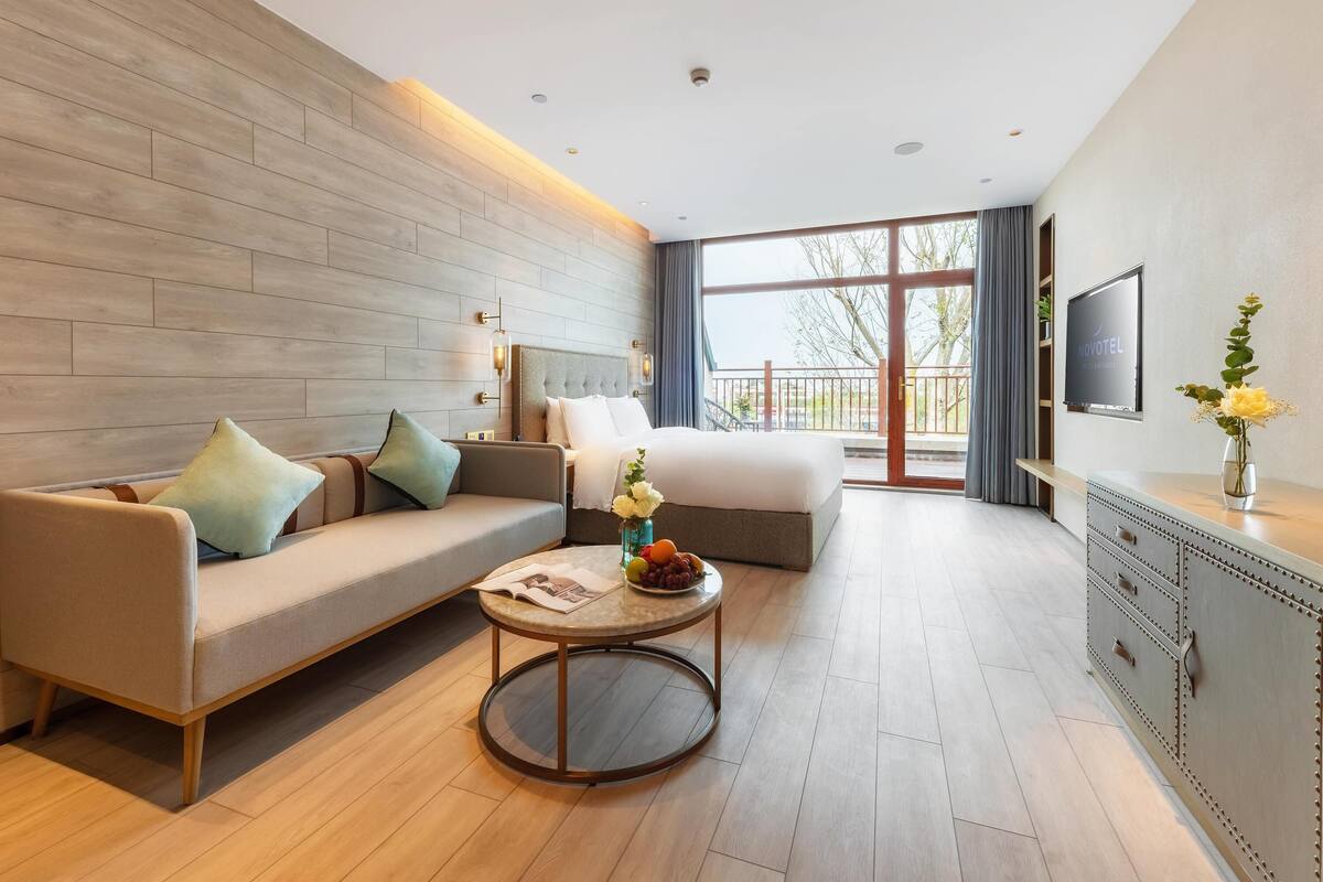 Deluxe Room, Multiple Beds | In-room safe, blackout drapes, WiFi (free), bed sheets