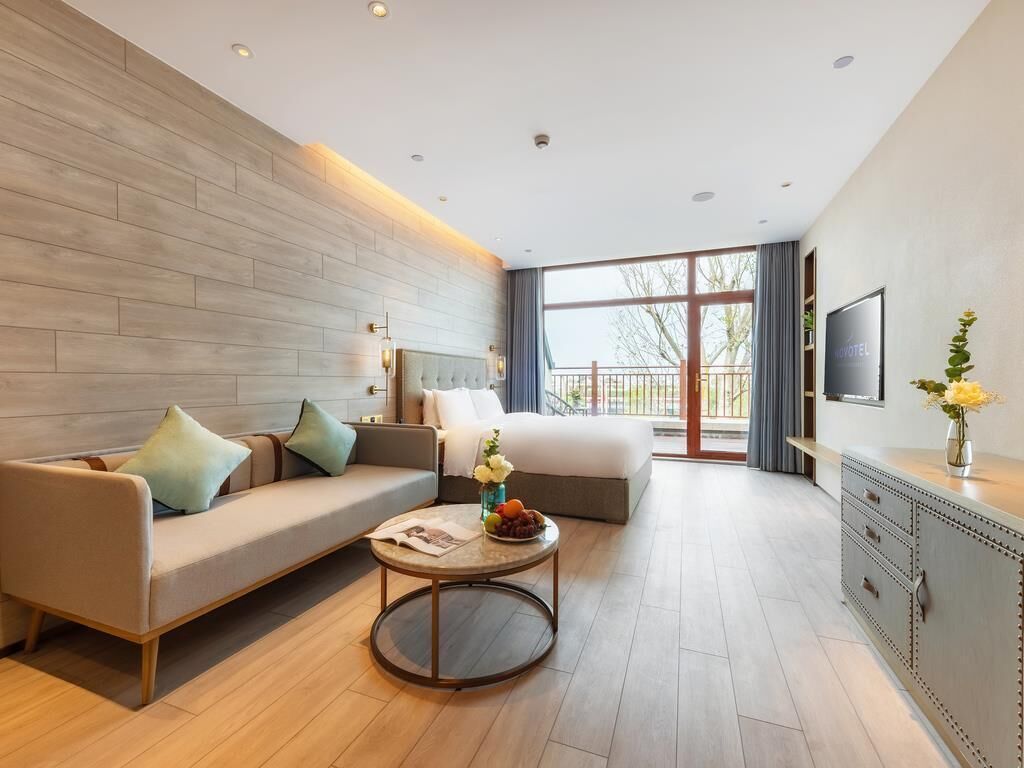 Deluxe Room, Multiple Beds | In-room safe, blackout drapes, free WiFi, bed sheets