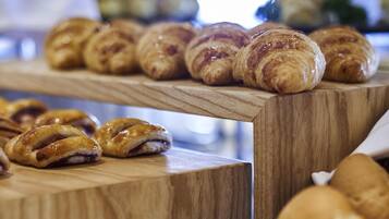 A wooden table with pastries.