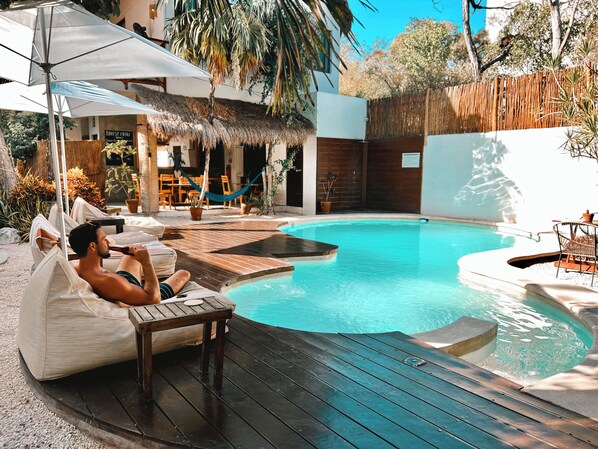 Outdoor pool, open 8:00 AM to 11:00 PM, pool loungers