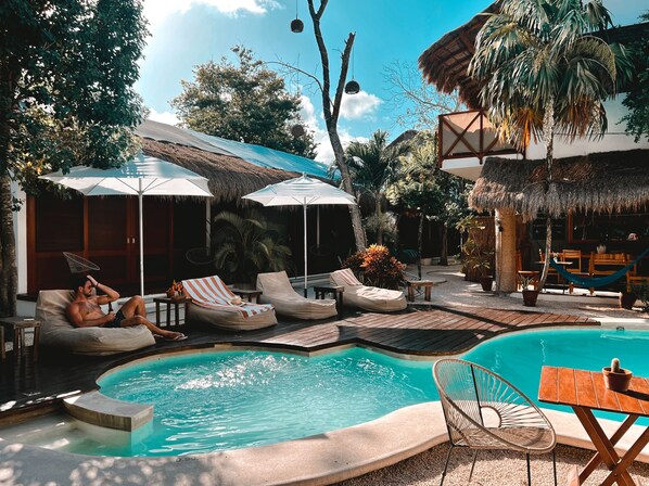 Outdoor pool, open 8:00 AM to 11:00 PM, sun loungers, lifeguards on site