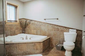 Combined shower/tub, hair dryer, towels, soap