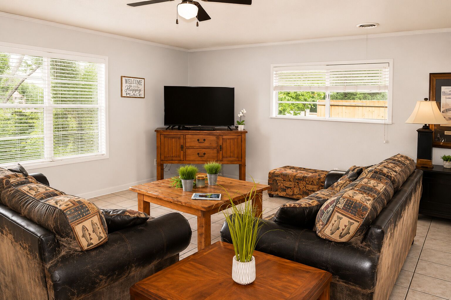 A living room with a sofa, a coffee table, a TV, and a cabinet.