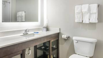 Combined shower/tub, designer toiletries, hair dryer, towels
