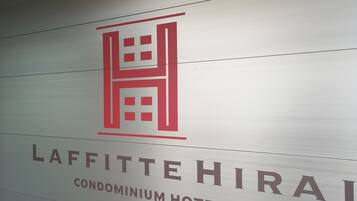 A sign for the Laffitte Hira Condominium Hotel.