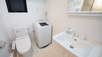Separate tub and shower, free toiletries, hair dryer, slippers