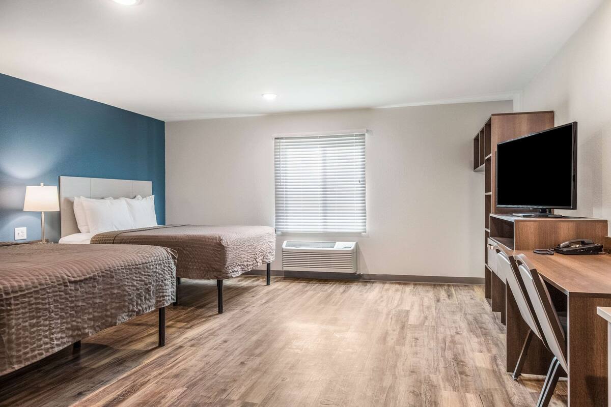 Memory-foam beds, desk, laptop workspace
