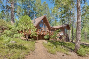A cabin with a large porch, surrounded by tall trees and a clear sky. - 6 Mi to Yosemite Nat'l Park: 14-Acre Retreat! (Groveland)